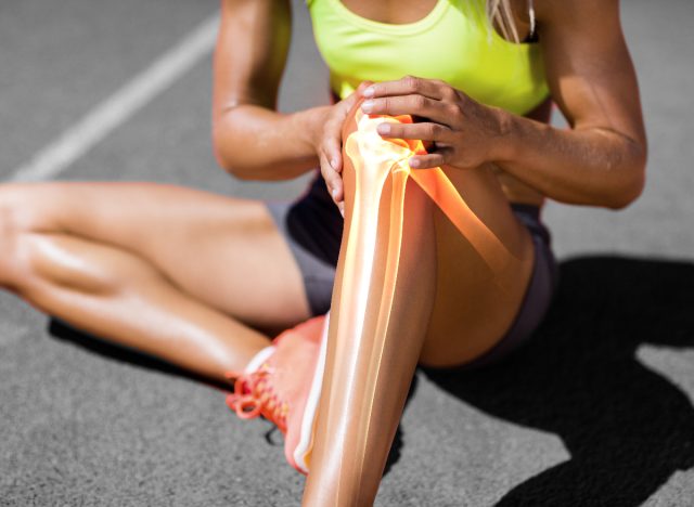 woman struggling with leg injury pain from not warming up before workouts