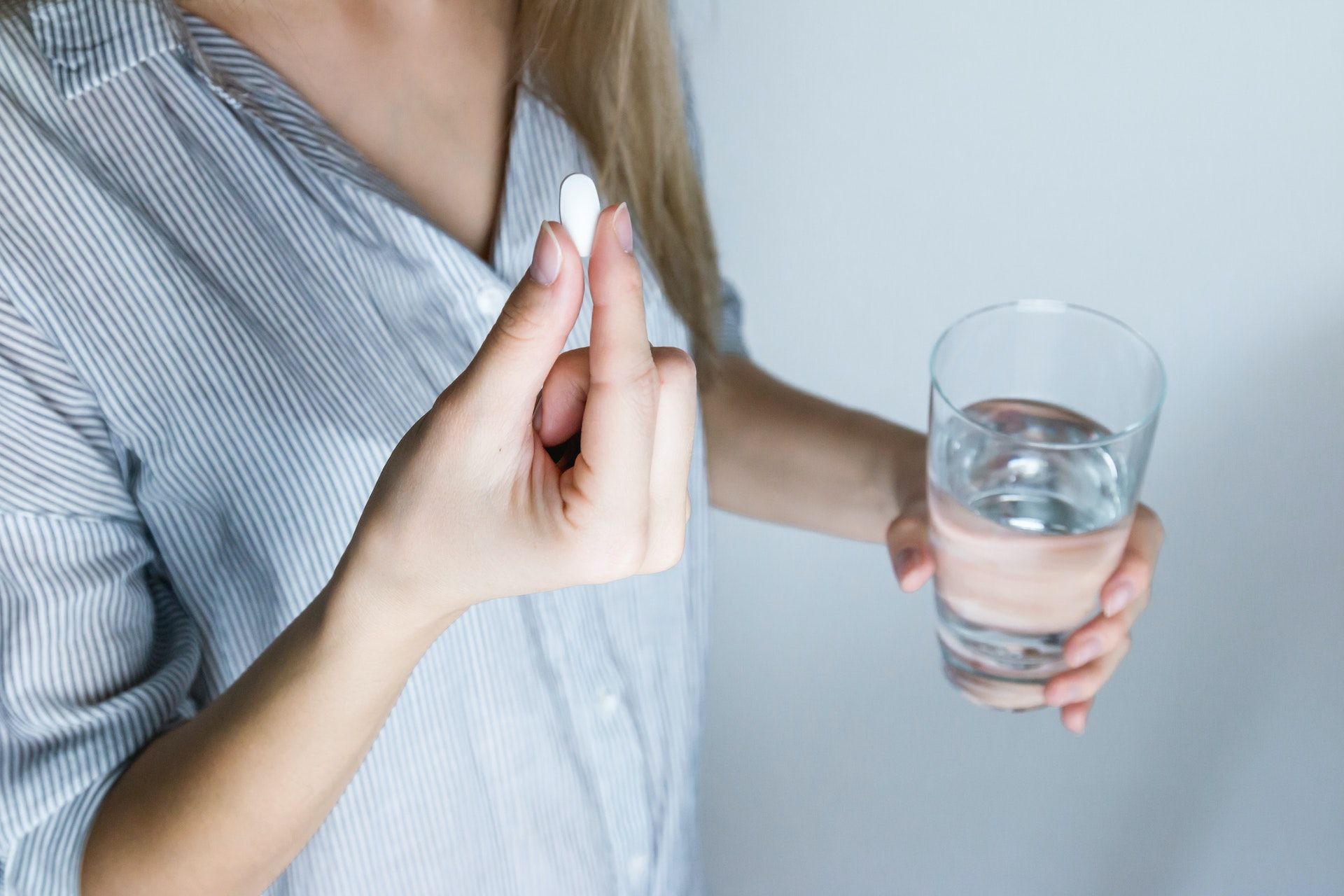 Taking over-the-counter medications can relieve tension headaches.  (Photo via Pexels/JESHOOTS.com)